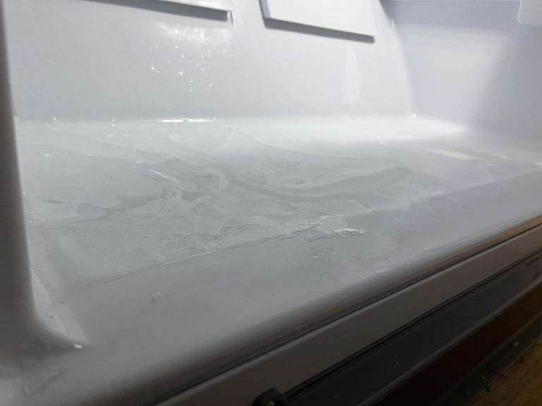 Why is There Ice in the Bottom of My Freezer? Causes & Solutions